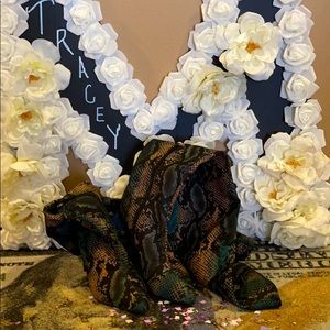 Snakeskin look over the knee boots